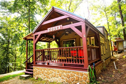 - Cozy cabin retreat with forest views and a welcoming porch space   - Private woodland escape ideal for peaceful getaways   - Rustic outdoor living perfect for relaxing in nature