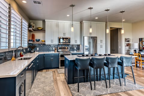 Kitchen - The Kitchen is complete with everything you will need for meal preparations including pots, pans, baking dishes, plates, cups, silverware, cutlery, and an assortment of cooking utensils.