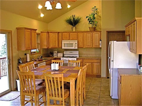 Large, open kitchen with bistro table.  Seats 8 comfortably.
