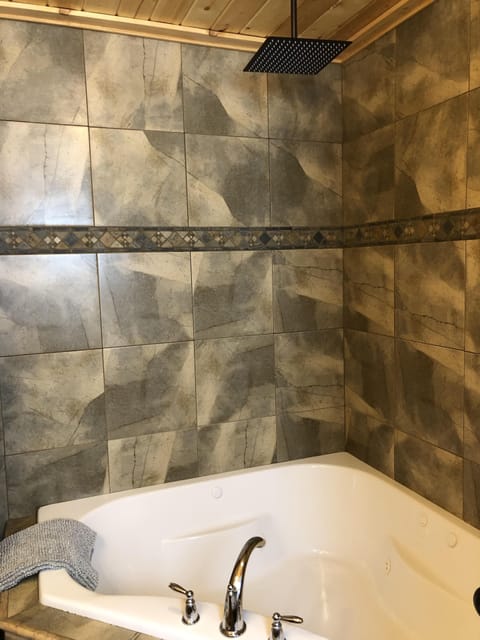 Angle 2 - Master bathroom with jetted tub and rain shower 