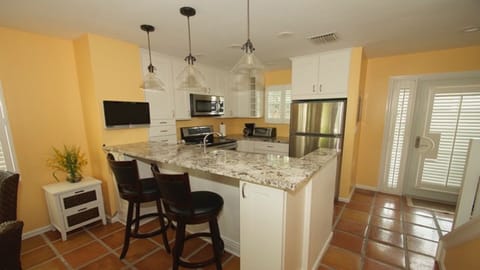 Updated kitchen with granite counter tops and stainless steel appliances. 