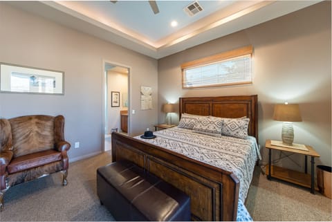 Main Bedroom with king bed and french doors that lead to the pool. 