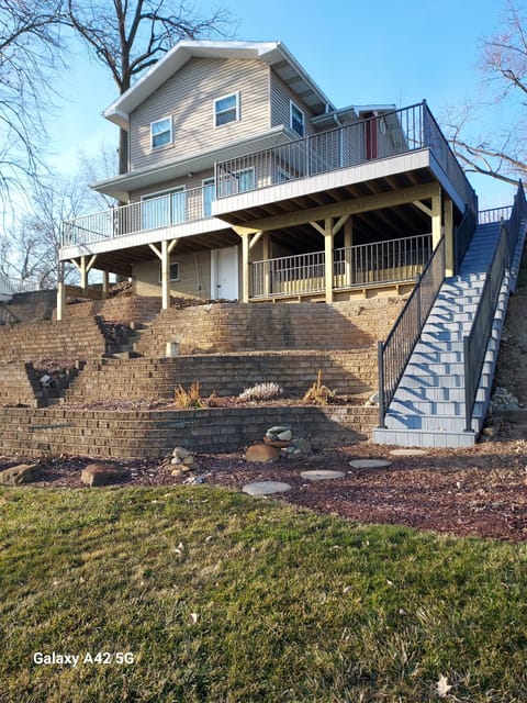View of house from lakefront. New deck and steps.