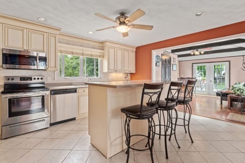 Large kitchen with island, ss appliances & open w/sunroom which opens to yard.