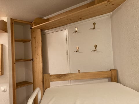 Storage for bunk bedroom and helmet hooks. Suitcases fit underneath the bunks.