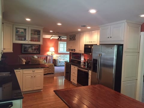 Gruene River Home Gourmet Kitchen w/Dining Area, looking into Living Room.