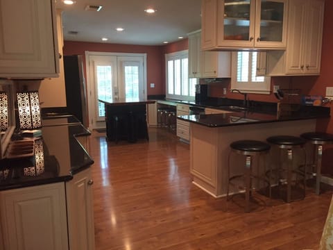 Gruene River Home Gourmet Kitchen, Bars, and Dining Area, from Living Room.