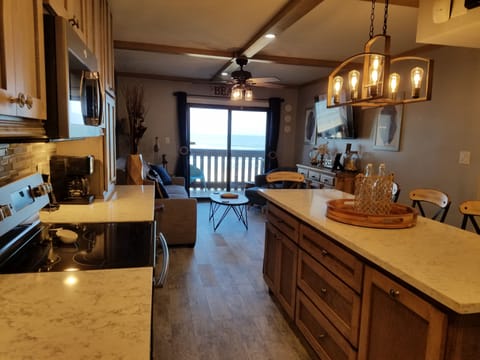 Cook in a 100% updated kitchen while you, socialize, cook & enjoy the beach-view