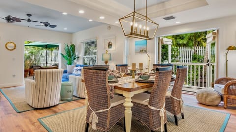 The dining room has a large dining table with seating for six...