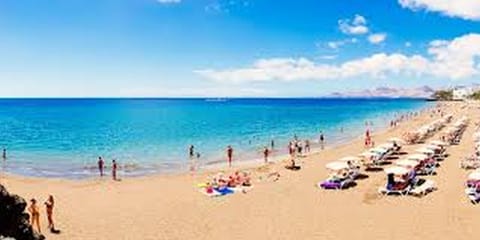 On the beach, sun loungers, beach towels