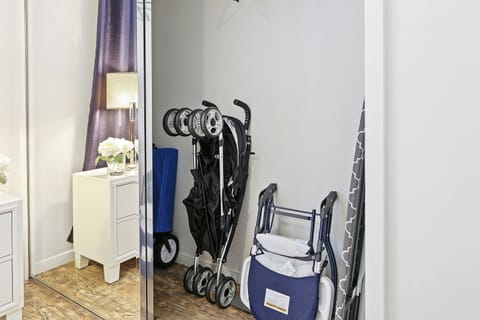 A modern bedroom with all the essentials: a large bed and wardrobe.