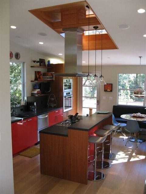 The well-equipped kitchen is just off the living room, with table & bar seating