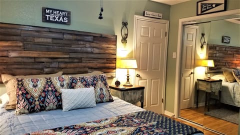 Master with half bath and custom made headboard, huge closet with mirrors