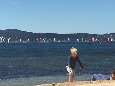 On the beach, sun loungers, beach towels