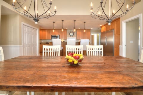 Large beautiful dining table open to kitchen and living room