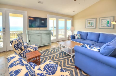 Living room looking with large windows to the ocean