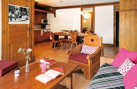 Find peace and relaxation with your close friends and family in this stunning open-concept living room featuring natural decor.