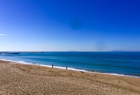 On the beach, sun loungers, beach towels