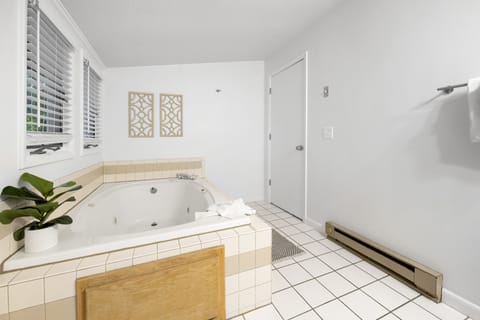 Jetted tub, hair dryer, towels, soap