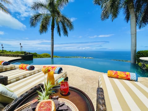 Private resort paradise! Sip poolside while you soak up some Hawaiian sunshine 