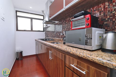 Fridge, microwave, coffee/tea maker, toaster