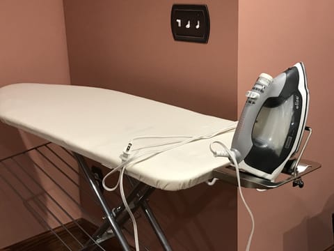 Wide ironing board and an Oliso auto lift iron available for quilters.