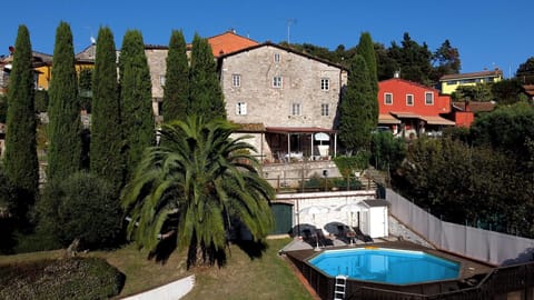 Building, Plant, Property, Sky, Azure, Tree, House, Arecales, Residential Area, Water