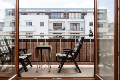 The balcony access from the living room adds to the charm and the garden furniture allows you to spend time outdoors.