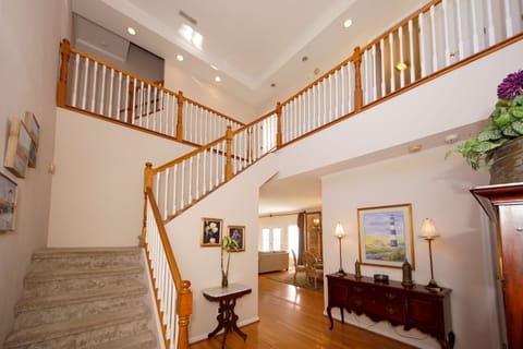 Spacious entry hall with view to main dining, main living room and second floor.