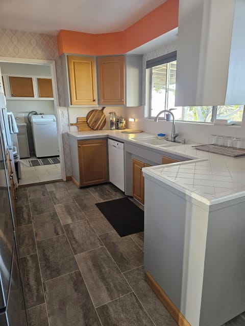 Kitchen with attached laundry room. 