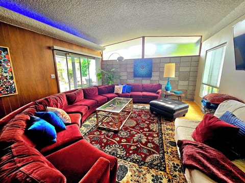 21 foot velvet sectional, smart TV, double size fold out bed. 