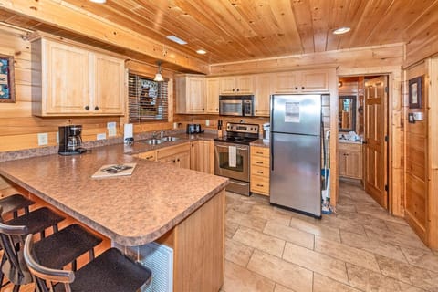 Countertop seating for 4 at the kitchen allows for easy conversation while cooking
