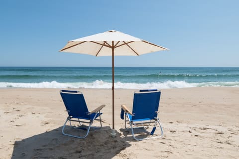 On the beach, sun loungers, beach towels