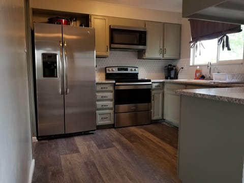 Kitchen with all stainless steel appliances including a dishwasher
