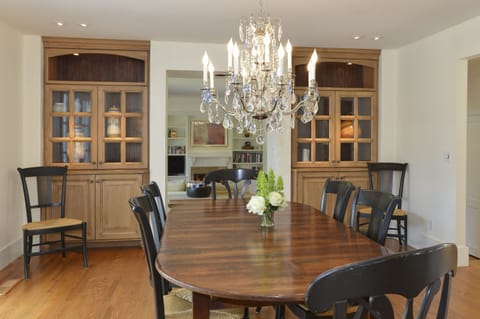 Dining room adjacent to living room and kitchen.