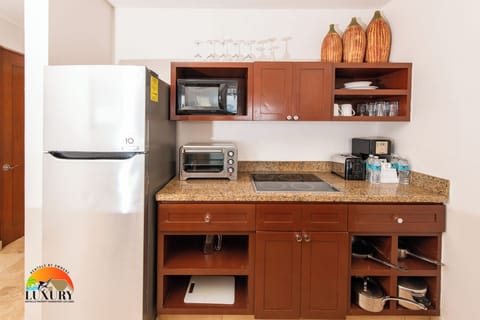 Fridge, microwave, stovetop, coffee/tea maker