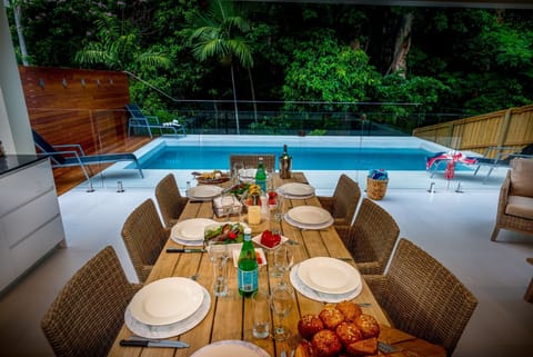 Enjoy a family feast overlooking the pool.