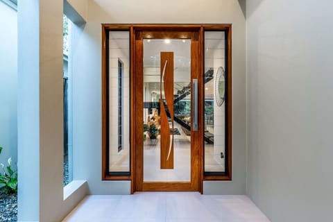 Our magnificent wood and glass front entrance door.