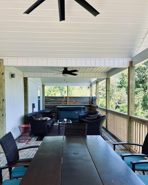 Covered back deck also has an outdoor eating area. 