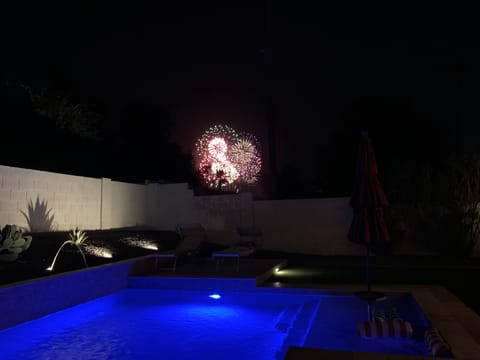 Watch fireworks at the Princess resort from the pool