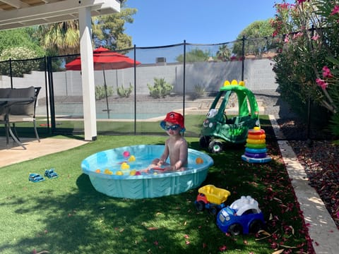 Pool safety fence and kiddie pool available when young children visit