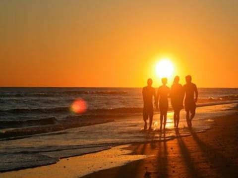 On the beach, sun loungers, beach towels