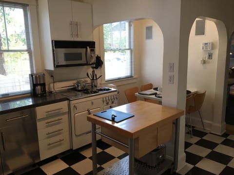 Kitchen looking West-vintage Chambers stove.  China and stainless for 12. 