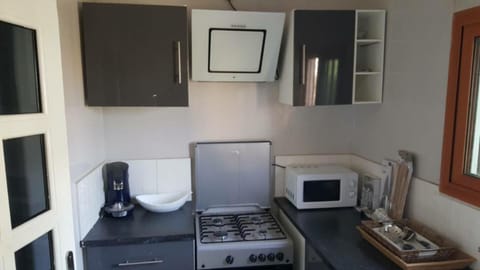 Fridge, microwave, cookware/dishes/utensils