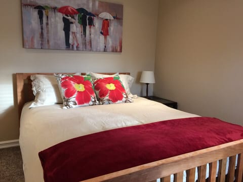 Hand Made Cherry Queen Bed in the spacious bedroom