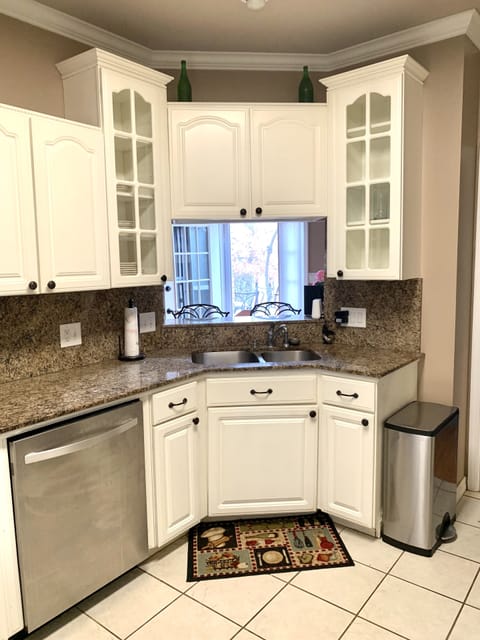 Kitchen with oven, stove, dishwasher, microwave, and refrigerator