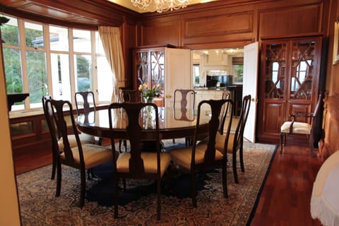 Wood paneled dining room with ocean view. Seating for 10-12 people.