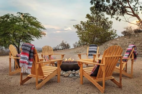 Outdoor fire pit and wooden chair