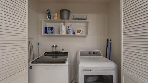Washer/dryer in upstairs guest bathroom.