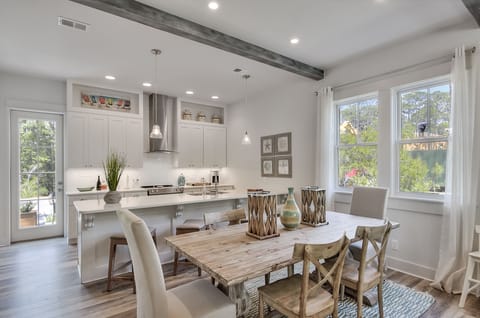 Dining area seats 6 at table and bar seating for 4